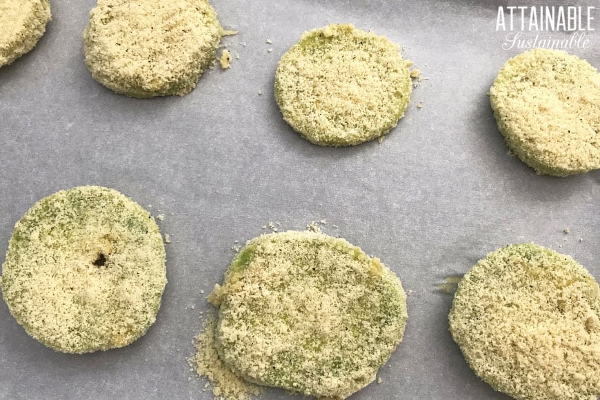 breaded fried green tomatoes on a cookie sheet