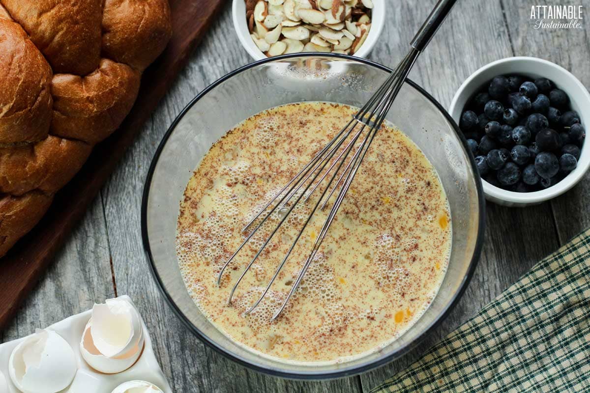 bowl of egg custard for making blueberry French toast casserole.