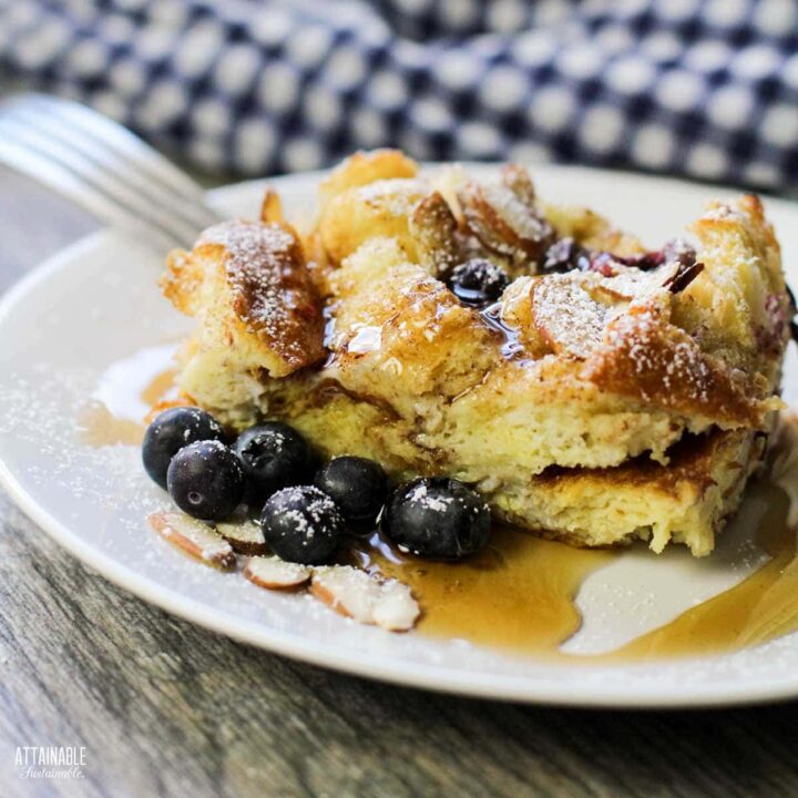 serving of blueberry french toast casserole on a white plate.