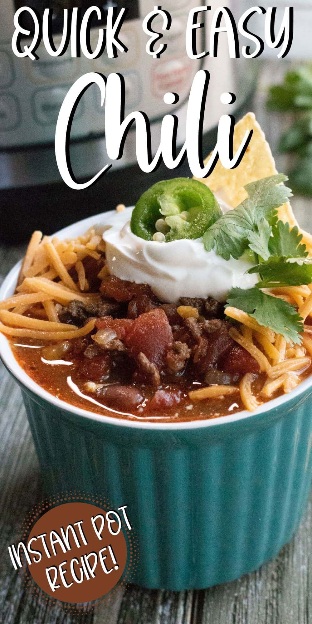 TEAL mug filled with chili, topped with cheese and sour cream