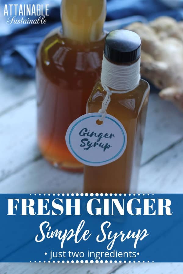 ginger simple syrup in two glass bottles with fresh ginger root and a blue towel