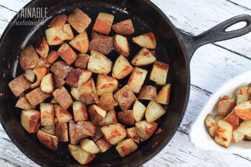 browned potatoes in a cast iron pan from above