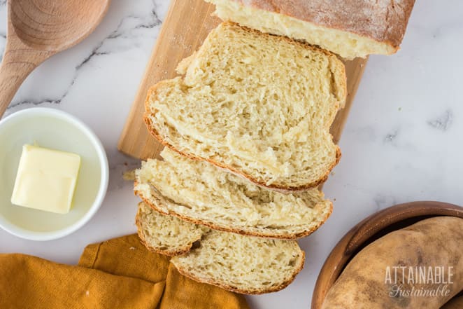 sliced loaf of bread on a cutting board from above