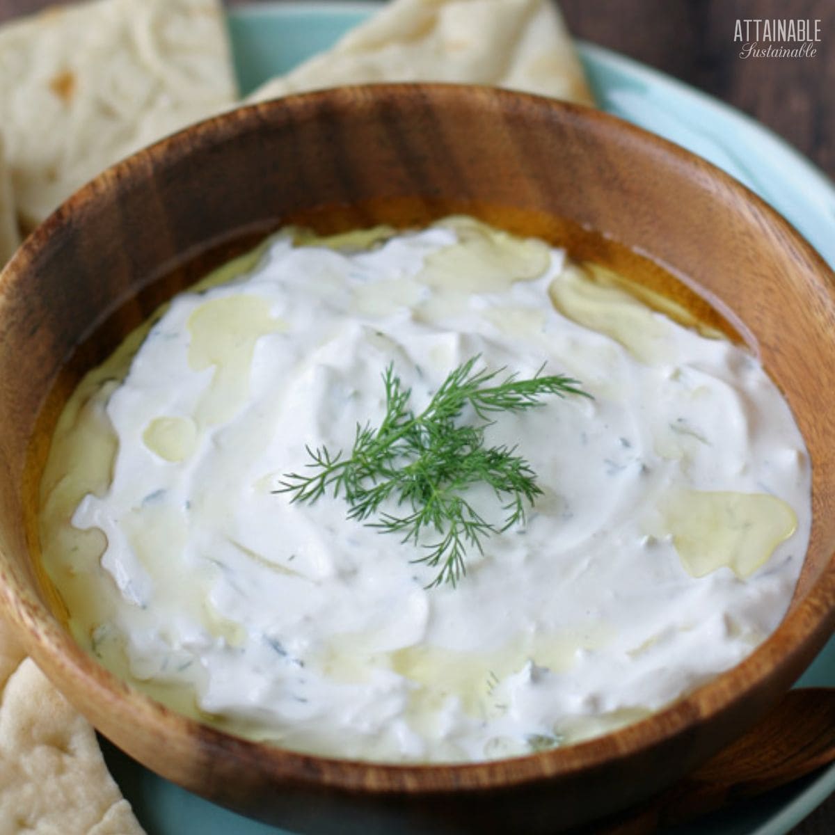 homemade tzatziki sauce in a wooden bowl.