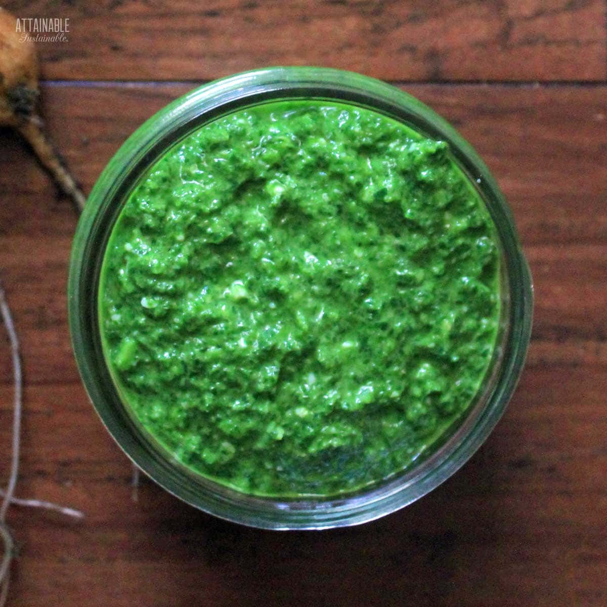 radish greens pesto in a glass jar.