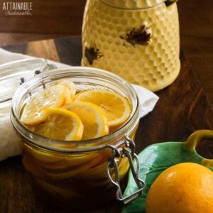 lemon fermented honey (with lemon slices) in a swing top glass jar.