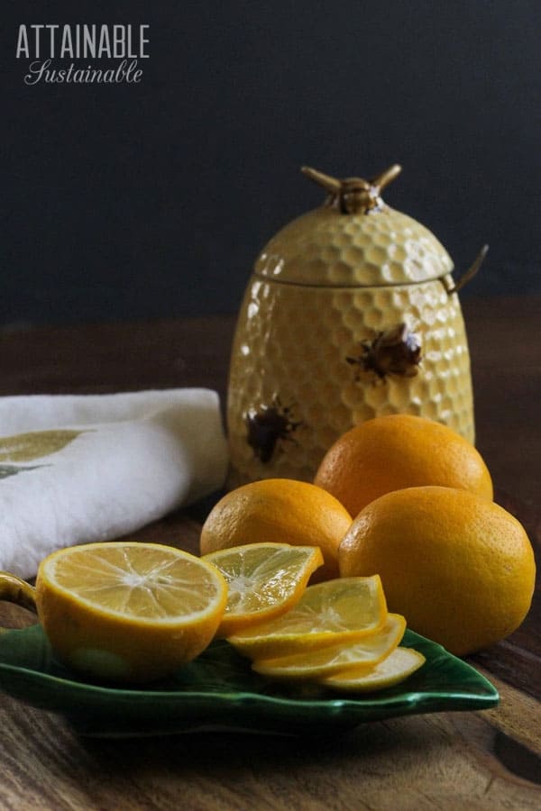 slice meyer lemons with a beehive vintage honey pot