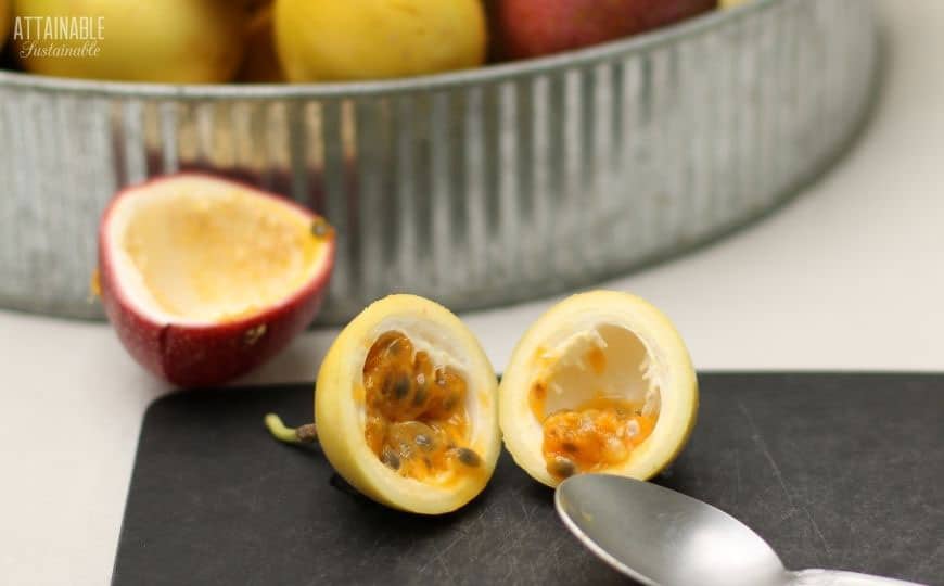 passion fruit cut in half exposing yellow pulp