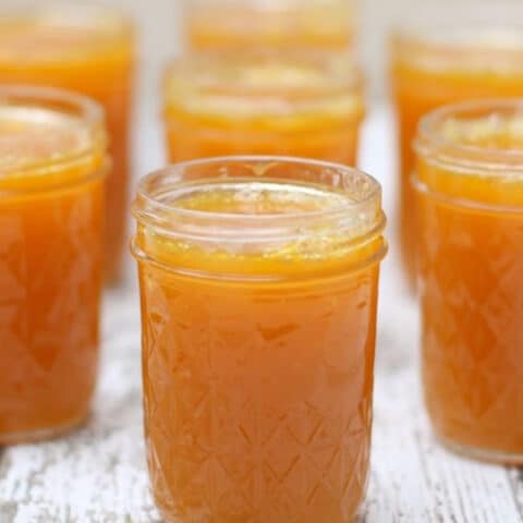 7 jars of yellow jelly in canning jars, no lids