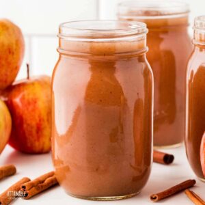 jar of apple butter at center of photo, more in background.