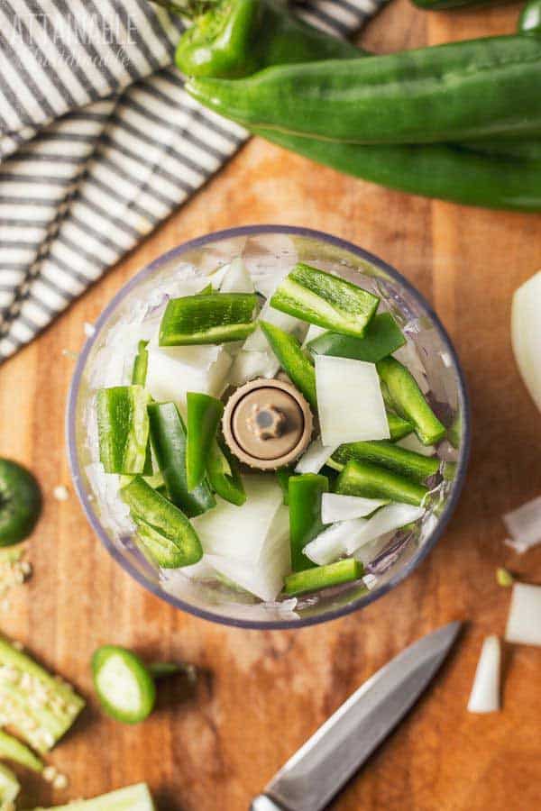 onions and peppers in a food processor from above