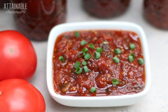 tomato chutney in jars and some in a square white dish