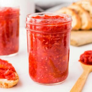 jar of raspberry jam, lid off.