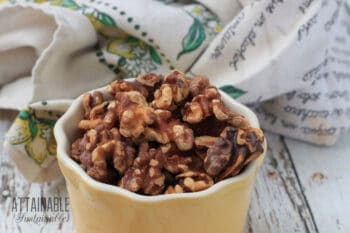 toasted walnuts in a yellow dish
