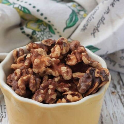 toasted walnuts in a yellow dish