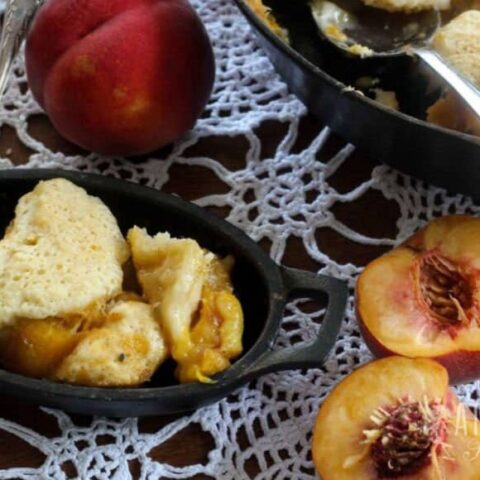 fresh peach cobbler in a cast iron dish