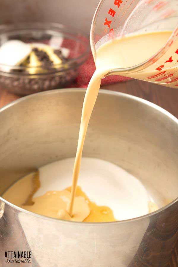 combining sugar and milk in a pot