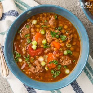 blue bowl filled with lentil stew from above.