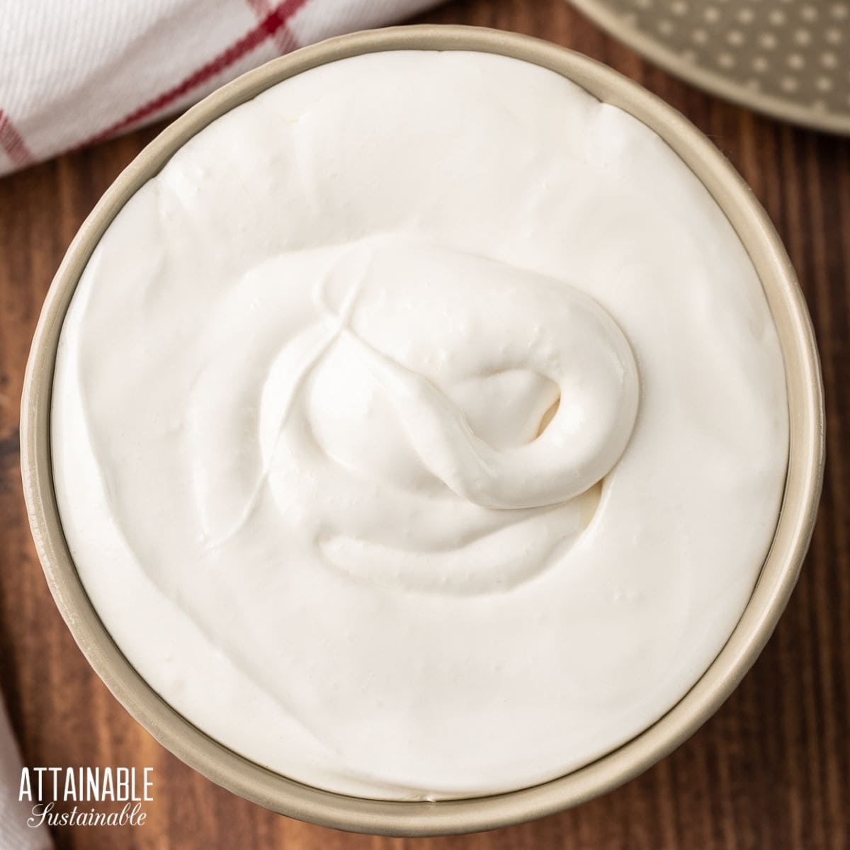 marshmallow fluff in a brown bowl from above.