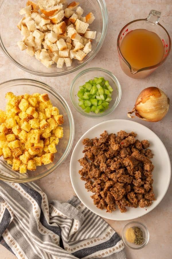 ingredients for stuffing: white bread cubes, cornbread cubes, celery, sausage, broth, spices