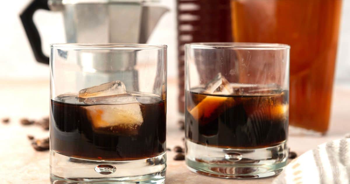 two highball glasses with kahlua and ice