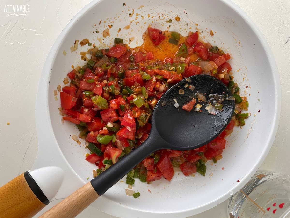 Cooking the salsa in a skillet.