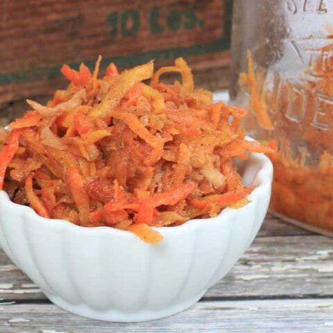fermented carrots in a white bowl