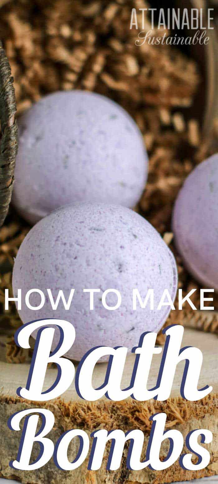 round purple bath bombs in a basket with shredded paper