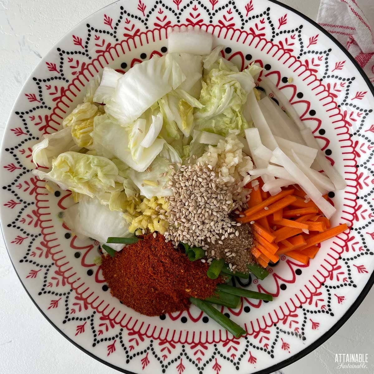 Ingredients for kimchi together in a bowl.