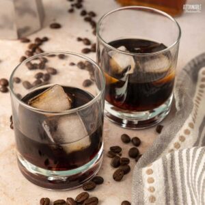 two glasses of kahlua with ice.