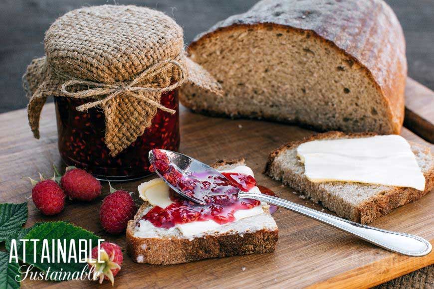 jam in a pretty jar, with a loaf of bread