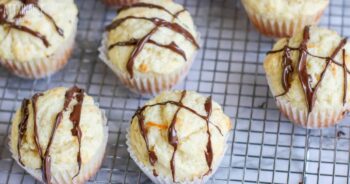muffins on a wire rack, drizzled with chocolate