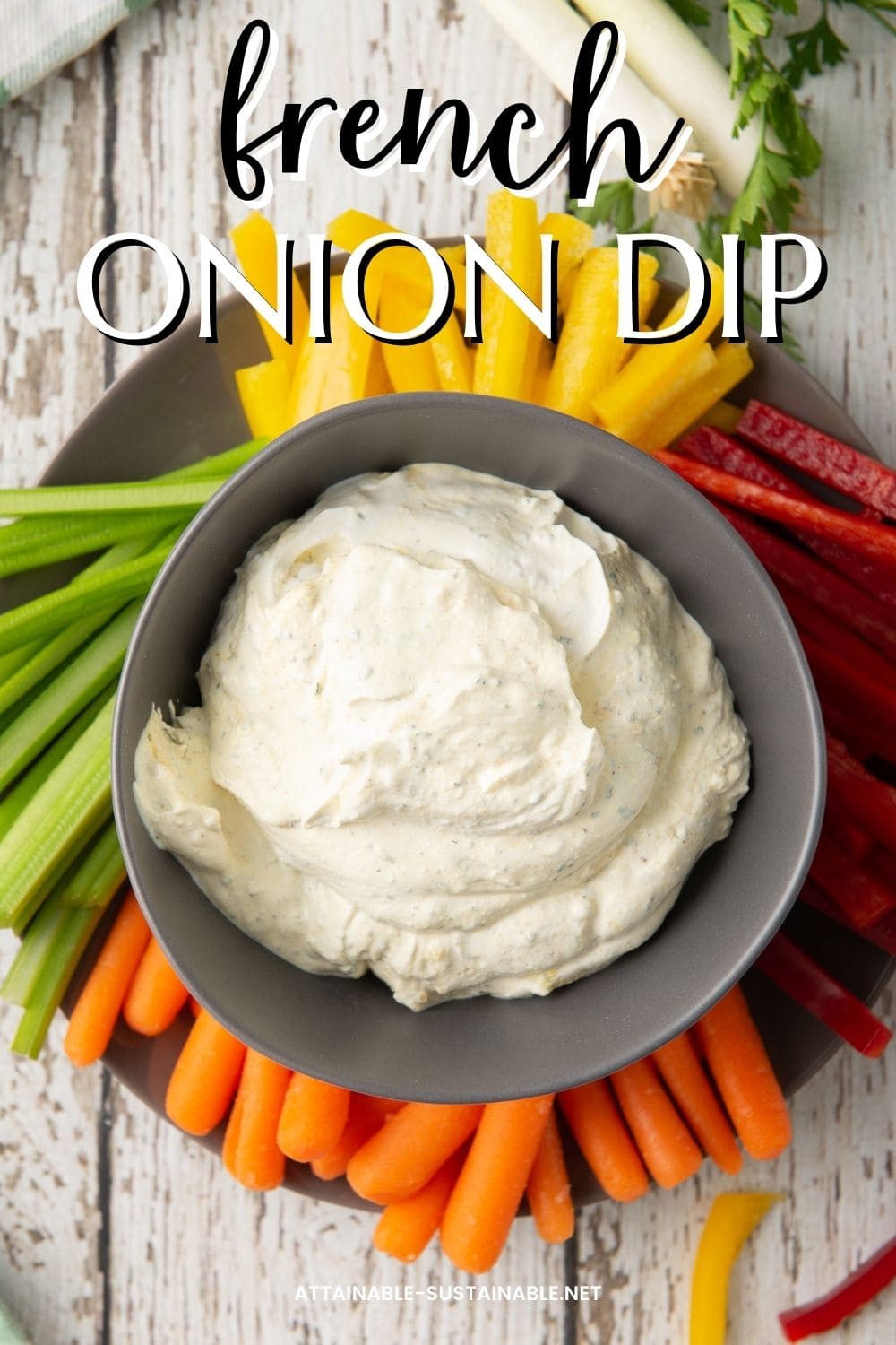 french onion dip served with brightly colored veggies.