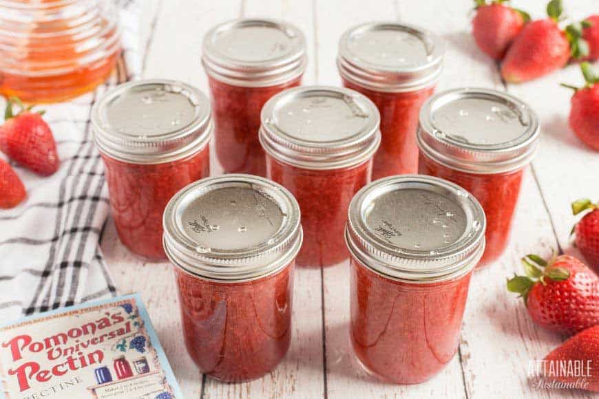 canning jars filled and sealed with strawberry jam