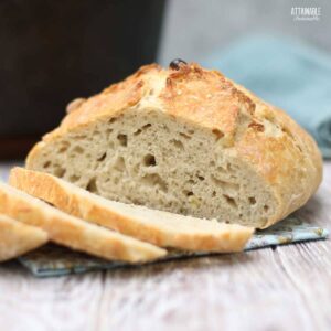 Loaf of bread with several slices.