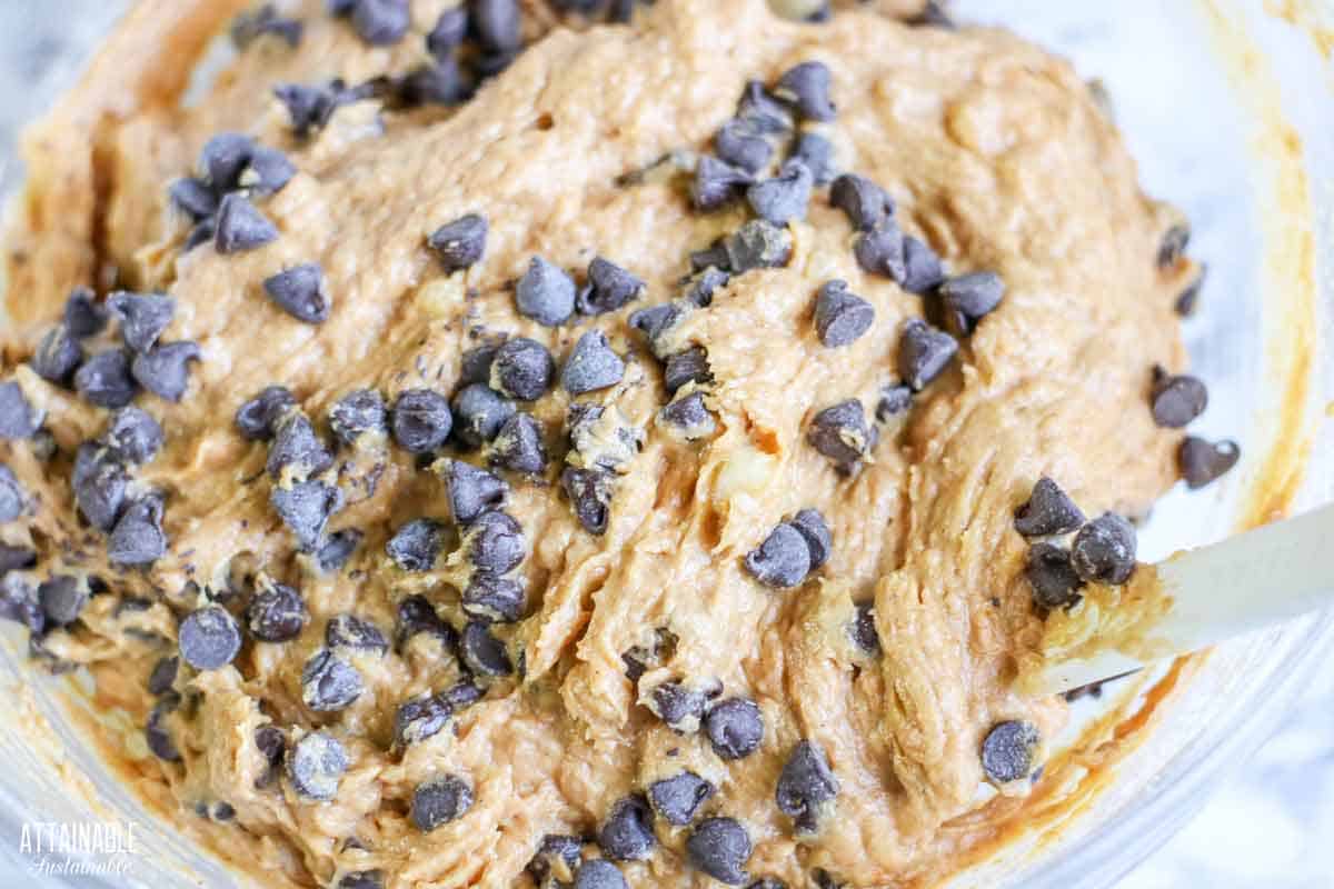 close up of dough with chocolate chips added.