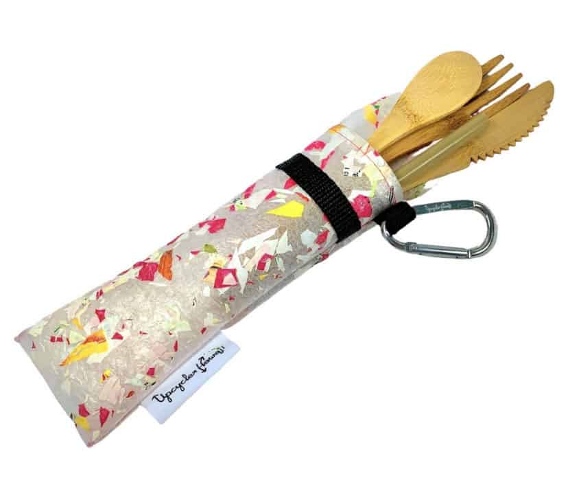 plastic tube holding bamboo utensils