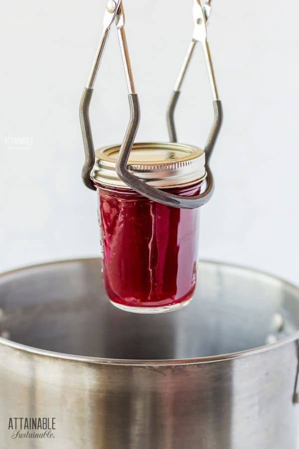 single jar in jar tongs above a big pot