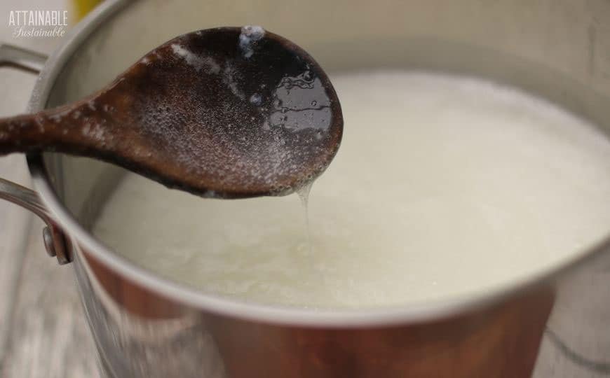 wooden spoon with soap mixture dripping off