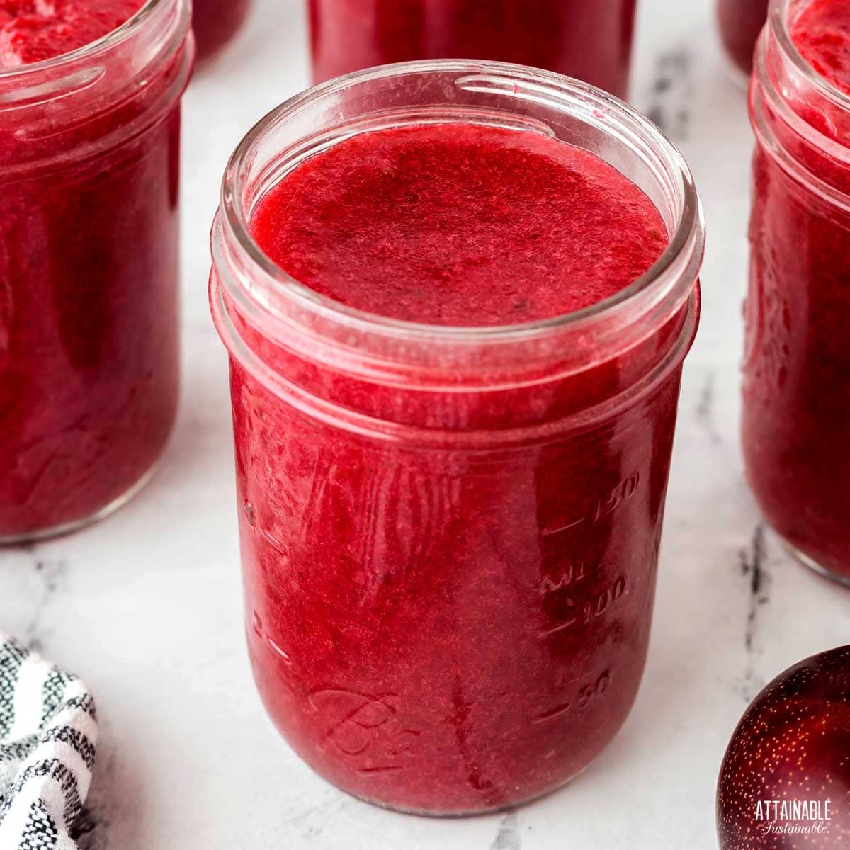 jars of plum jam ready for the lids.