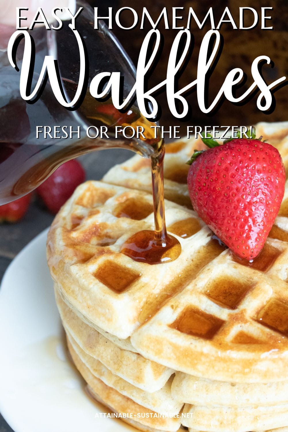 syrup being poured on a stack of waffles with a whole strawberry on top.