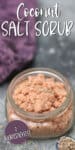 SHORT glass jar full of pink salt scrub with lavender flowers
