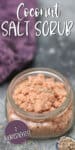 SHORT glass jar full of pink salt scrub with lavender flowers