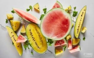 yellow and red watermelon slices on a white background