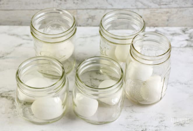 white hard boiled eggs in jars.