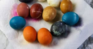 colorful naturally dyed eggs on a paper towel