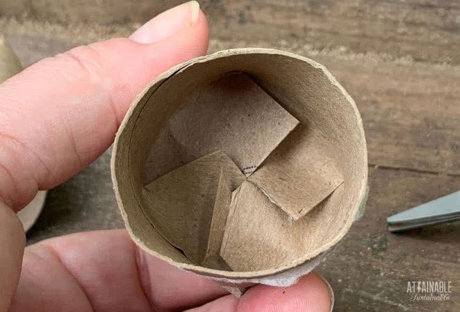 cardboard tube with ends folded in to be a seed starter pot