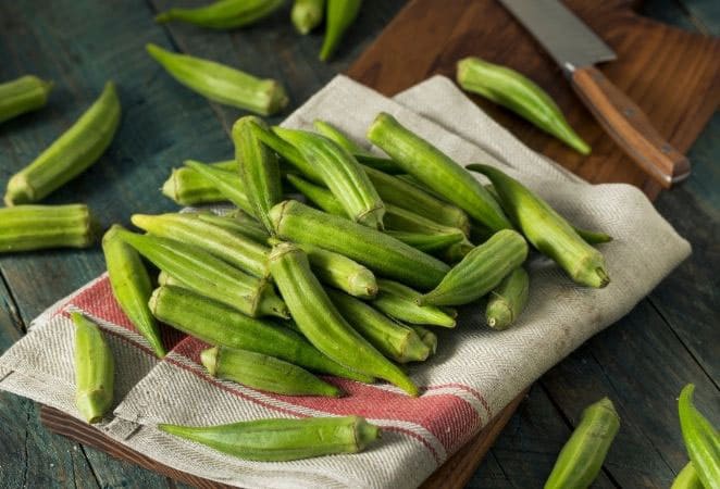 green pods on a linen towel