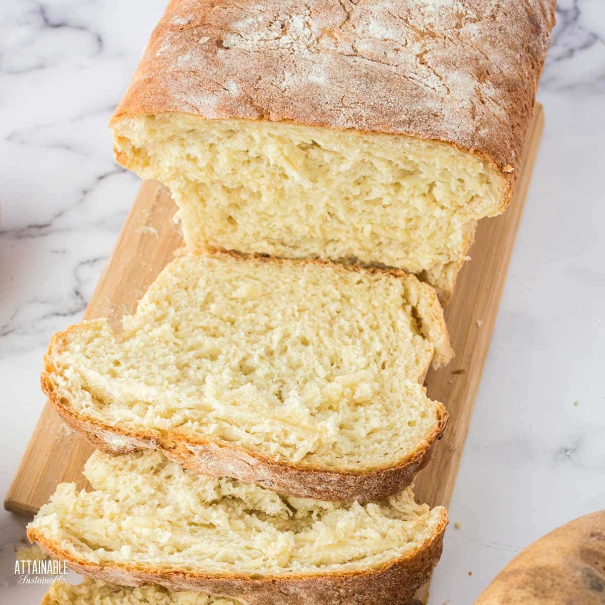 loaf of potato bread with slices cut.