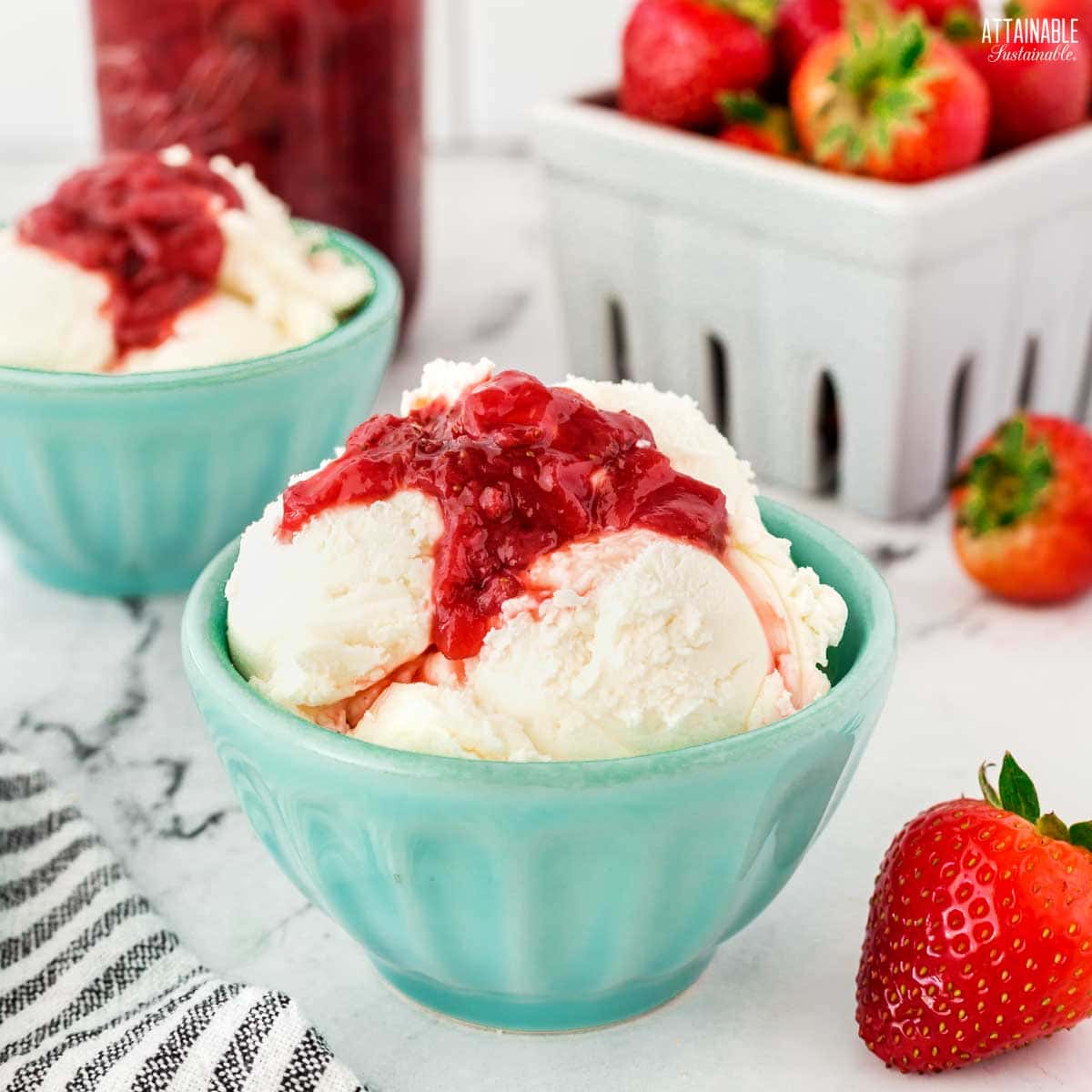 ice cream topped with berry sauce.
